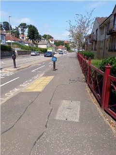 Bearsway pavement with houses on either side.