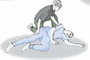 care worker managing a falling client - supporting the client while lying on the floor