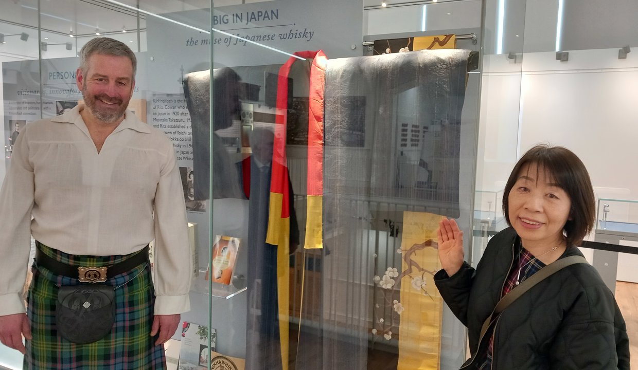 Jimmy Watson and Naoko Nakamato are pictured standing next to a display of items related to Rita in Kirkintilloch Town Hall